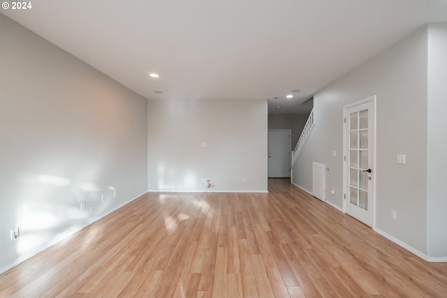 spare room with light hardwood / wood-style flooring