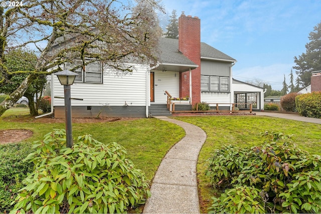 bungalow-style house with a front yard