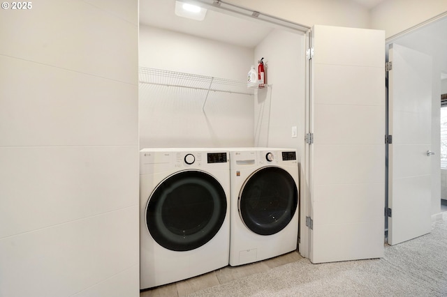 laundry room with washer and clothes dryer