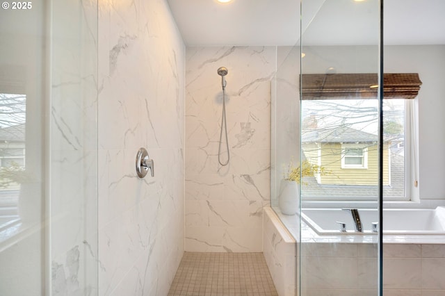 bathroom featuring separate shower and tub