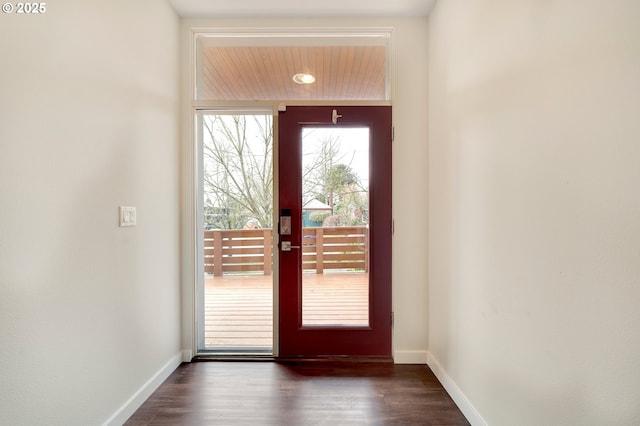 doorway featuring dark hardwood / wood-style flooring and plenty of natural light