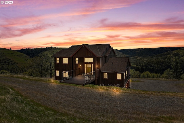 modern farmhouse with a deck with mountain view