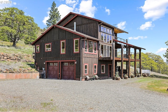 view of front of house with a balcony and a garage