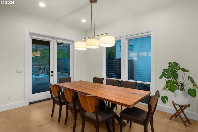 dining area featuring french doors and light hardwood / wood-style floors