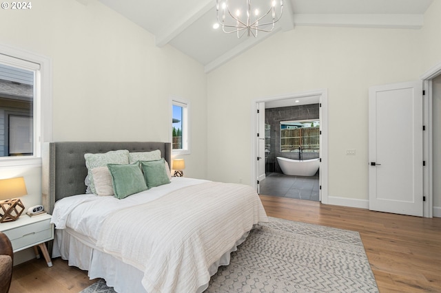 bedroom featuring ensuite bathroom, hardwood / wood-style floors, beam ceiling, a notable chandelier, and high vaulted ceiling