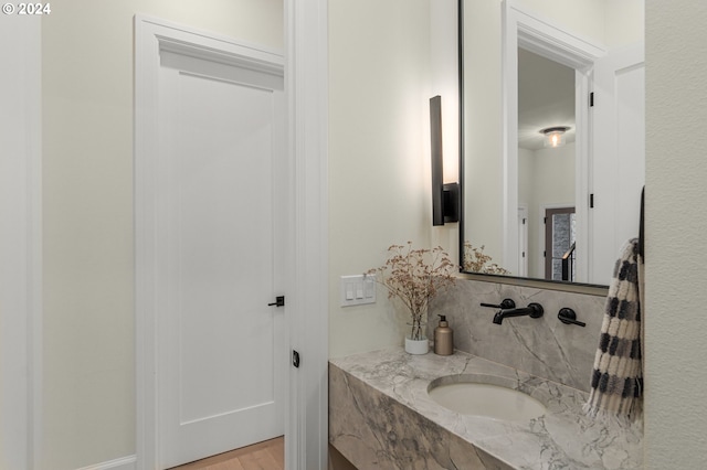 bathroom with hardwood / wood-style floors and vanity