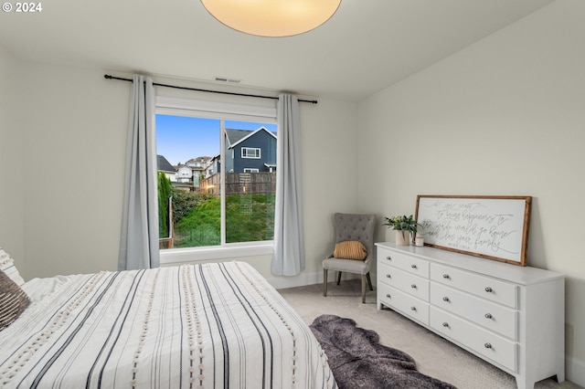 bedroom with light carpet