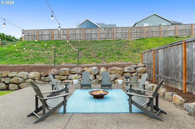 view of patio / terrace with an outdoor fire pit