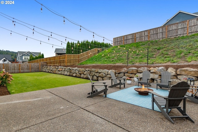 view of patio / terrace with an outdoor fire pit