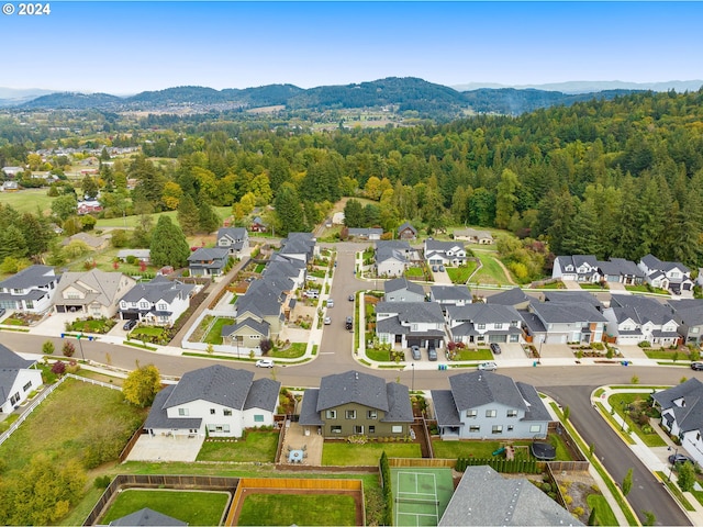 birds eye view of property with a mountain view