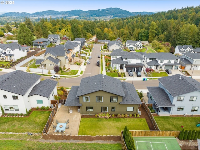 birds eye view of property featuring a mountain view