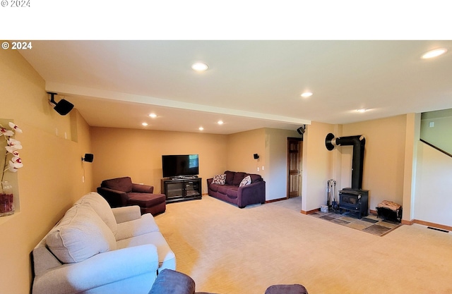 living room featuring a wood stove and light colored carpet