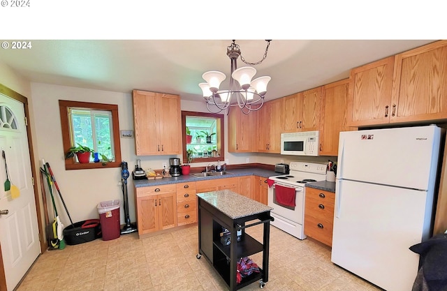 kitchen featuring sink, light brown cabinetry, decorative light fixtures, white appliances, and a notable chandelier