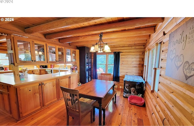 dining area with light wood-type flooring, a chandelier, wooden ceiling, and beamed ceiling