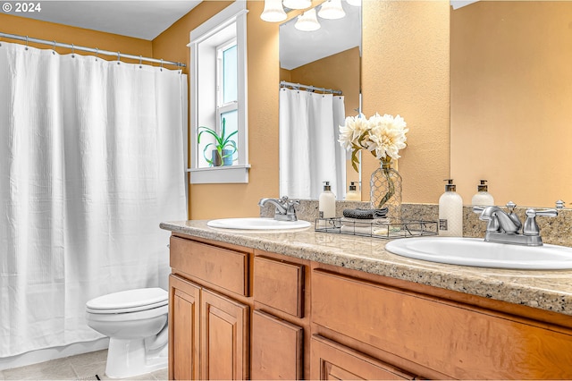 bathroom with tile patterned flooring, walk in shower, vanity, and toilet