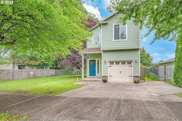 view of front of property with a garage and a front yard