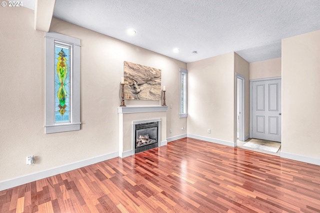 unfurnished dining area featuring light hardwood / wood-style floors and a chandelier