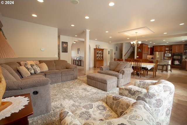 living room featuring an inviting chandelier