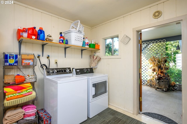 clothes washing area with washing machine and dryer