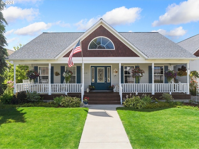 view of front of house featuring a front yard and a porch