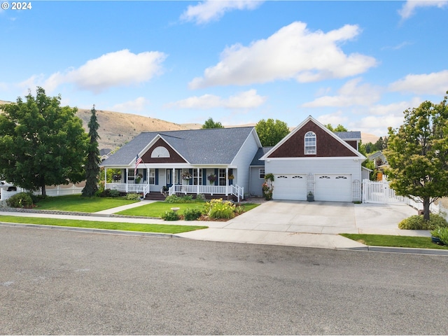 view of front of property with a mountain view, a front lawn, and a porch