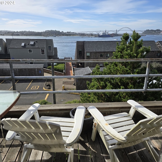 balcony featuring a water view