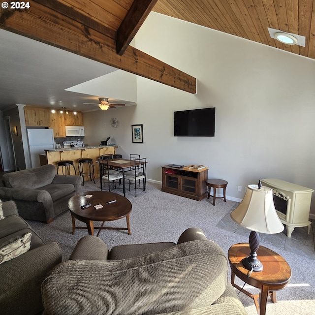 carpeted living room featuring ceiling fan, lofted ceiling with beams, and wooden ceiling