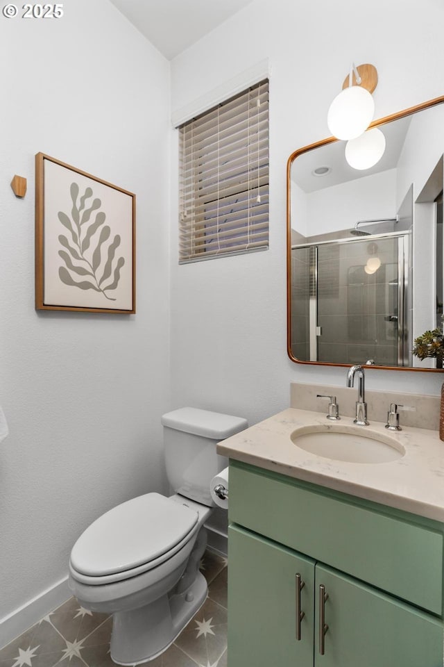 bathroom featuring toilet, tile patterned flooring, vanity, and walk in shower