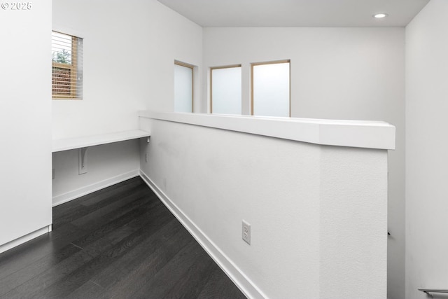 hallway featuring dark wood-type flooring