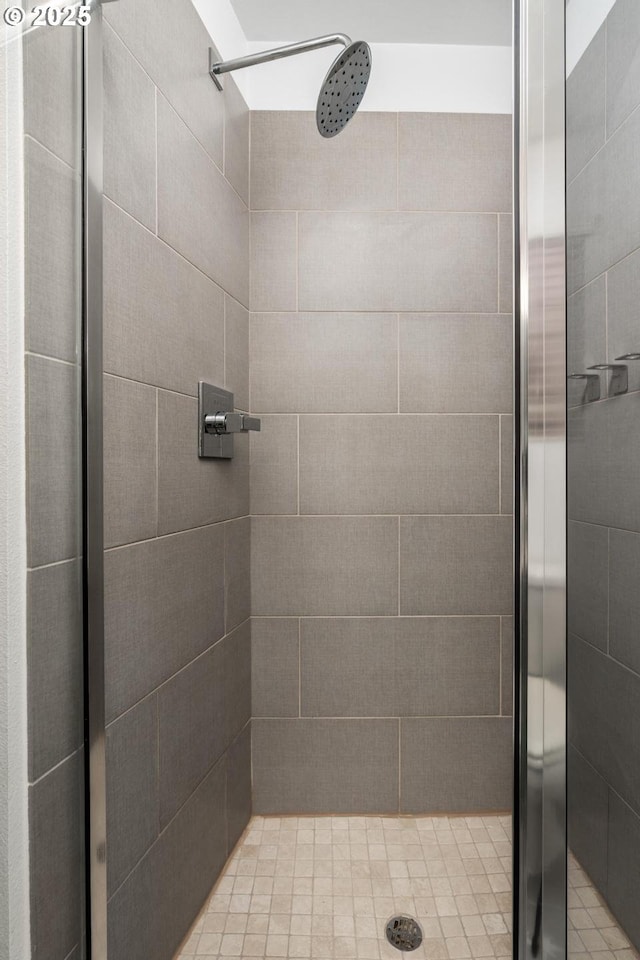 bathroom with tiled shower