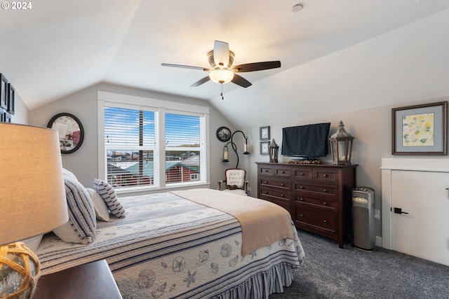 bedroom featuring dark colored carpet, ceiling fan, and lofted ceiling