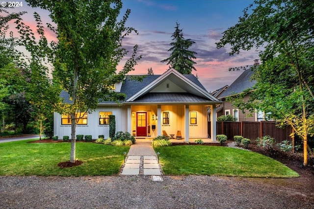 view of front of home with a yard