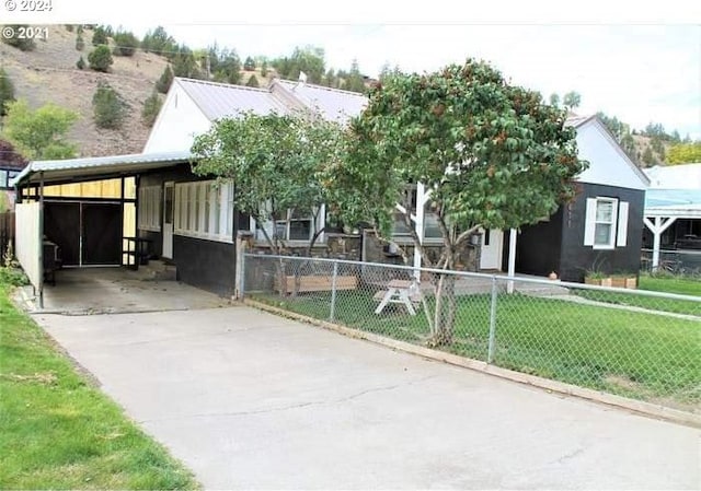 view of front of home with a carport