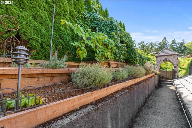 view of swimming pool featuring a fenced in pool and a deck