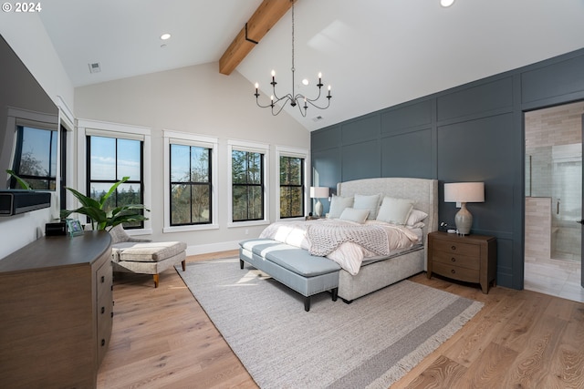 bedroom with beamed ceiling, an inviting chandelier, multiple windows, and light hardwood / wood-style flooring