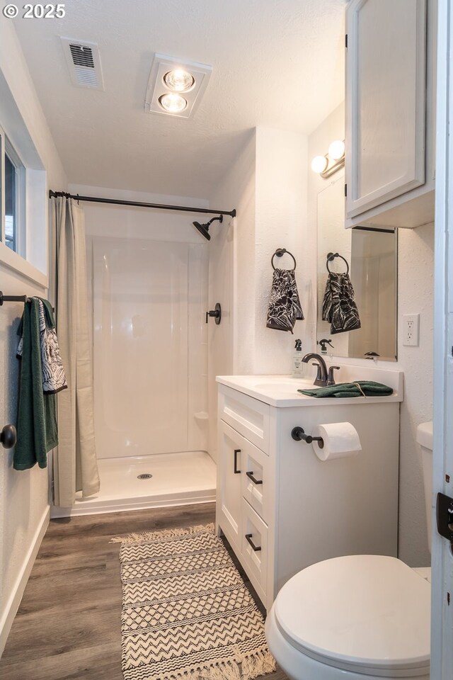 kitchen featuring plenty of natural light, white cabinets, white appliances, and sink