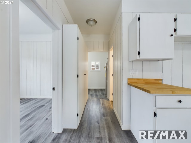 hall with wood-type flooring