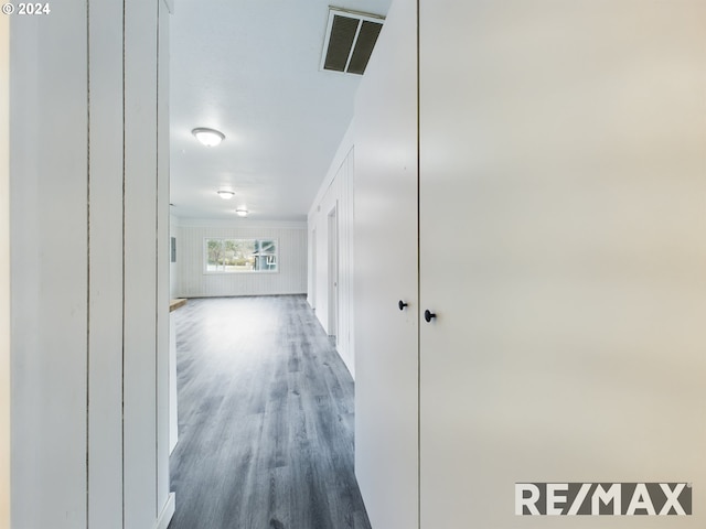 corridor featuring dark hardwood / wood-style floors