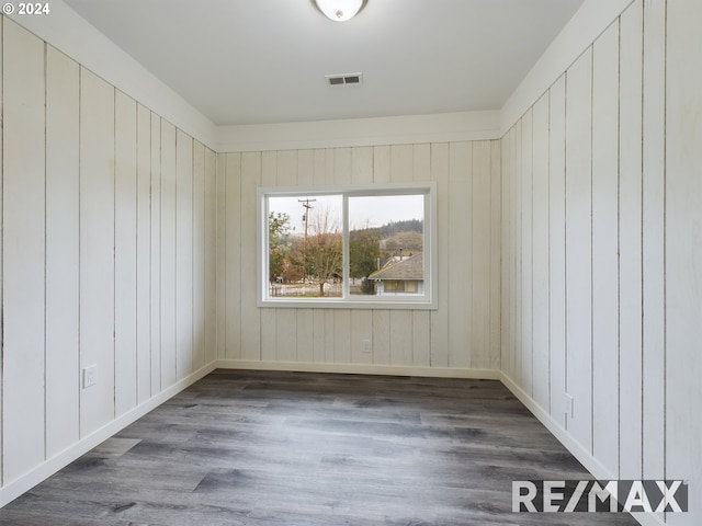 empty room featuring dark wood-type flooring