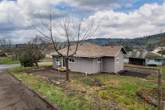 view of side of property featuring a mountain view