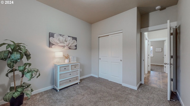 bedroom with carpet floors and a closet