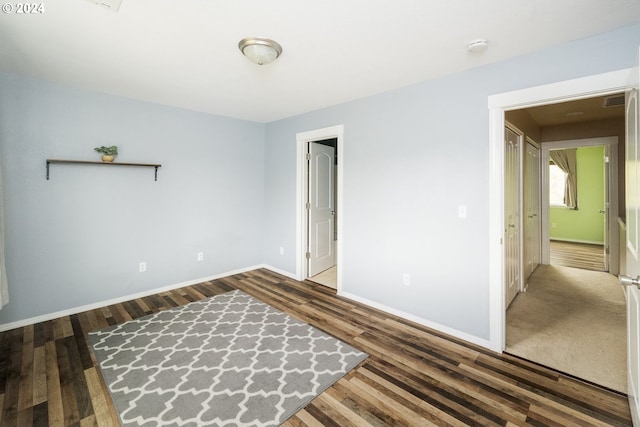 spare room featuring dark hardwood / wood-style flooring