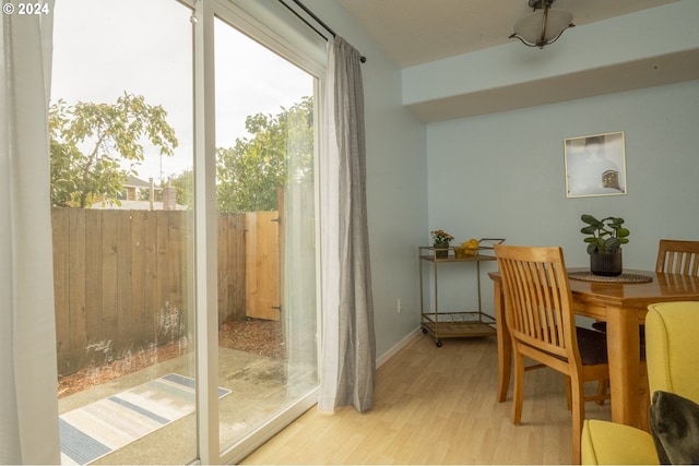 dining space with light hardwood / wood-style flooring