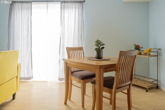 dining area with light hardwood / wood-style floors