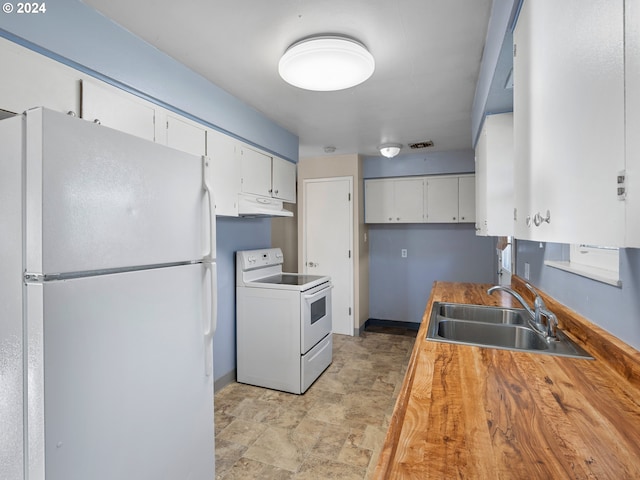 kitchen with white cabinetry, butcher block counters, white appliances, and sink