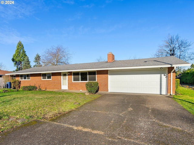 single story home featuring a front yard and a garage