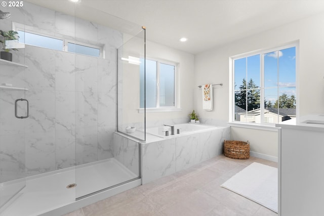 bathroom featuring plus walk in shower and tile patterned flooring