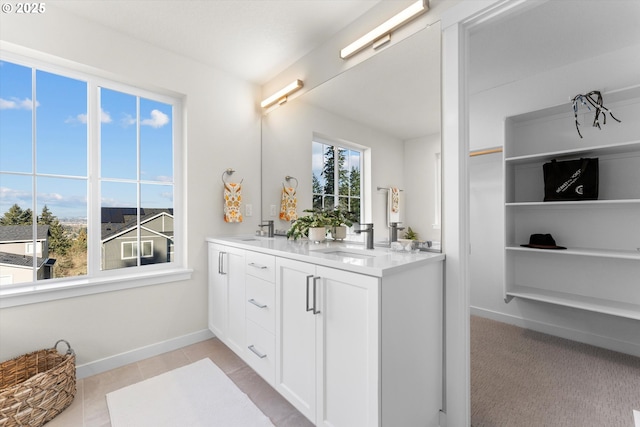 bathroom with tile patterned flooring and vanity