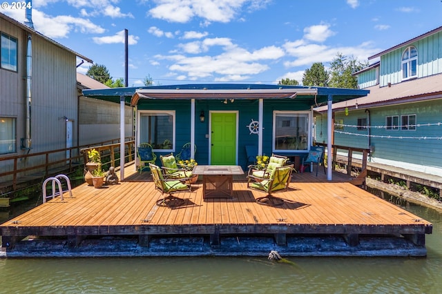 exterior space with a deck with water view