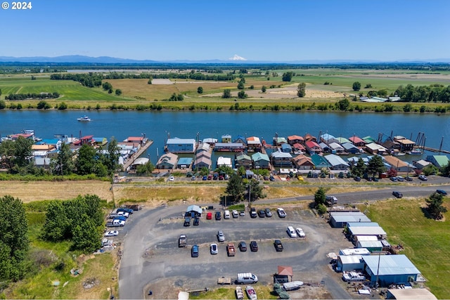 aerial view with a rural view and a water view